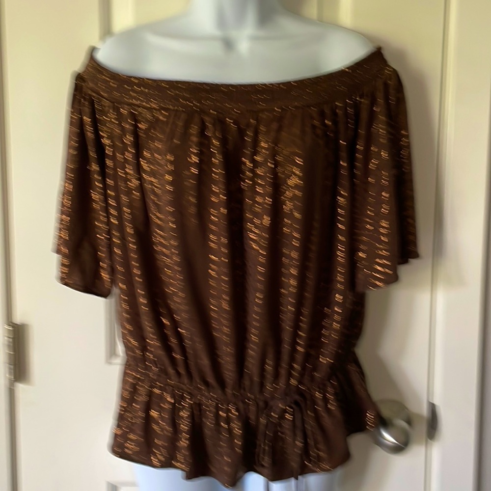 Off shoulder top. Drawstring waist. Short sleeves. Approximately 19” long.